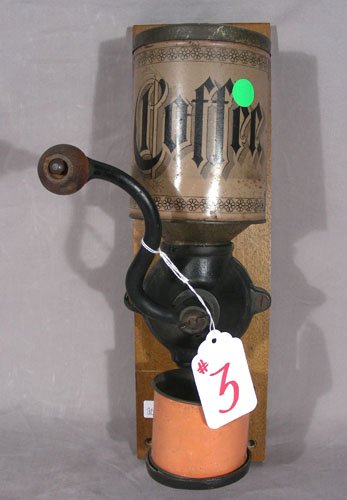 ANTIQUE COFFEE GRINDER BY THE FANNER MANUFACTURING CO.: 15" high.
