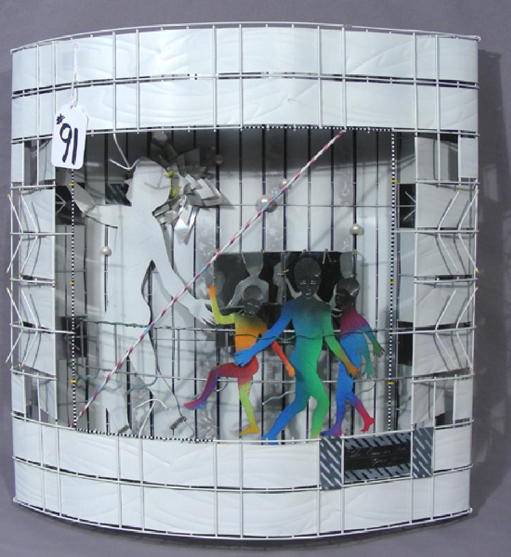 ORIGINAL JAMIE DAVIS METAL WALL ART SCULPTURE: Three dimentional hand painted wall art sculpture with figures. Hand signed and titled "The Boys are Free". Circa 1992. 20" high, 20 1/2" wide.