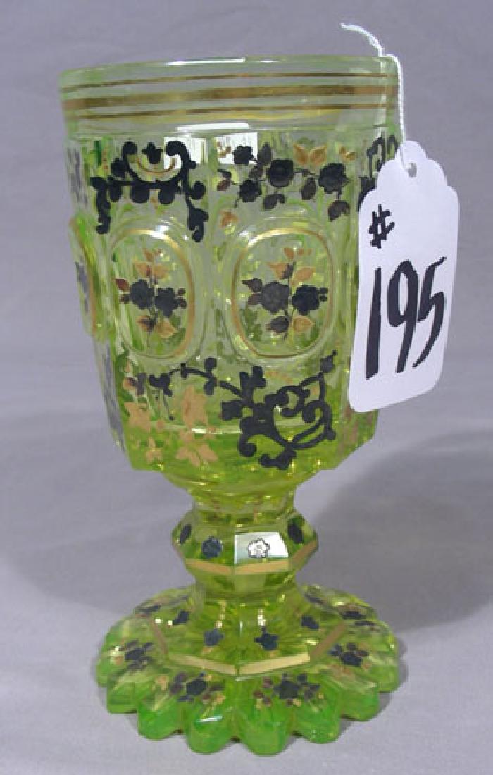 VINTAGE HAND PAINTED VASELINE GLASS CHALICE: An unusual chalice with scalloped base and hand painted flowers. Gilt rim. 7" high.