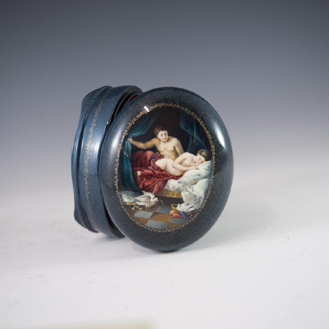 Russian Erotic Lacquered Papier Mache Box: DESCRIPTION: A Russian lacquered erotic papier mache box. Features an oval shape embellished with a rich blue hue further garnished with lighter blue veined striations. Further embellished with a man