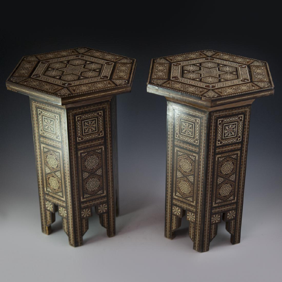 Damascus Inlaid Wooden Tables: DESCRIPTION: A pair of Damascus, Syrian, inlaid wooden hexagonal tables. Embellished with traditional Damascene mosaic inlay patterns of ebony, bone, and mother of pearl in geometric accents centered