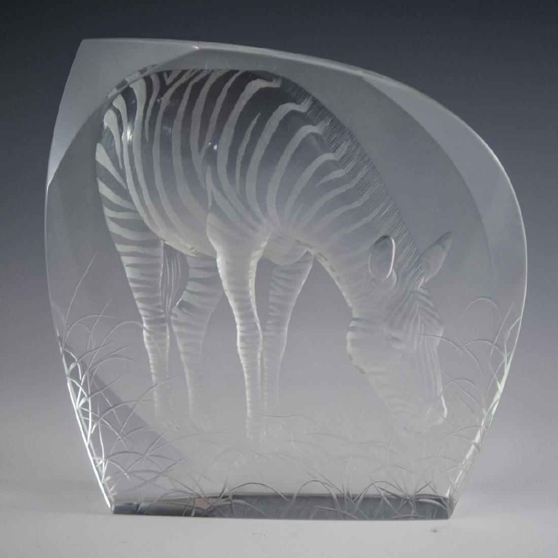 Moser Crystal Zebra Relief: DESCRIPTION: A Moser crystal relief plaque. Features an impressed, concaved scene of a grazing zebra with frosted crystal stripes along its body enveloped with frosted crystal background and detailed,
