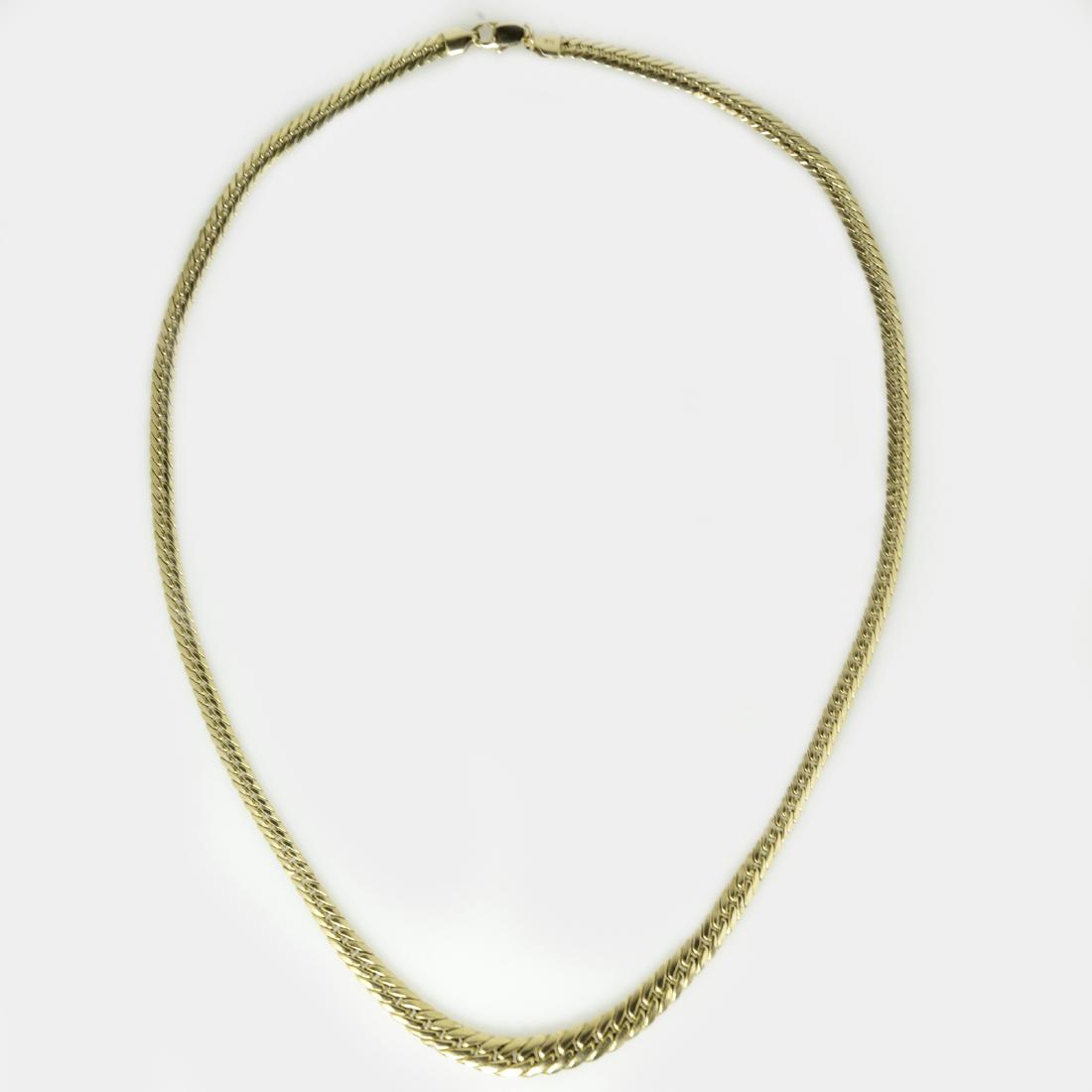 14kt Gold Cuban Link Necklace: DESCRIPTION: A 14kt yellow gold Cuban link chain necklace. Comprises of Cuban links that increase in size along the middle of the chain. Fitted with a lobster claw clasp and marked:"14kt". CIRCA: 20th