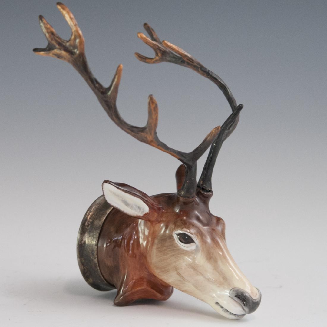 Bloor China Stoke On Trent Stirrup Cup: DESCRIPTION: A Bloor China Stoke on Trent stirrup cup on the motif of a buck with copper with antlers. Hand Painted in an overall glossed glaze and finished with a silver plate collar. Marked along th