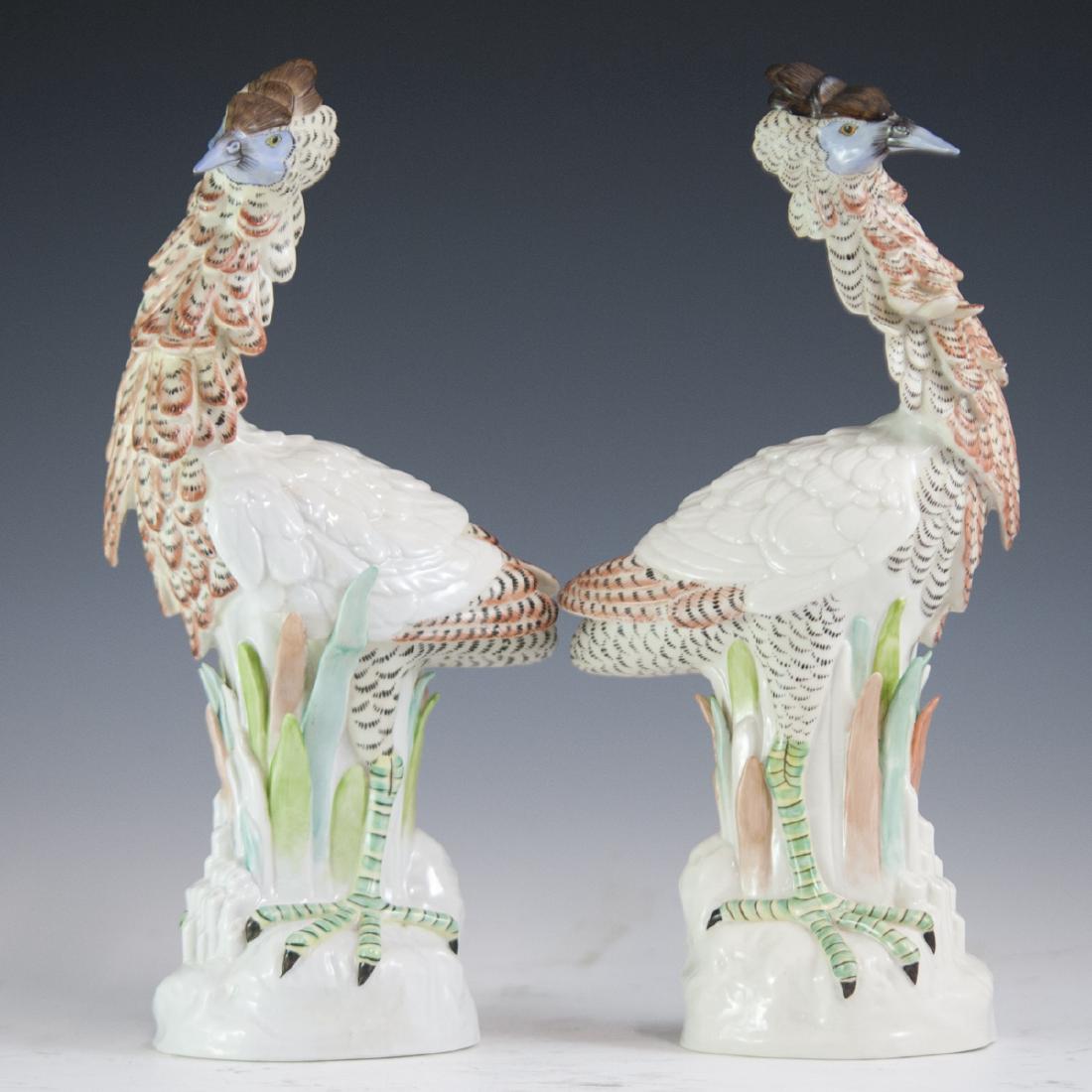 Mottahedeh Italian Porcelain Exotic Birds: DESCRIPTION: A pair of Mottahedeh Italian porcelain figurines in the motif of exotic birds, possibly cassowaries, although uncertain. Finished in vibrantly hued colors and an overall glossed glaze. Th