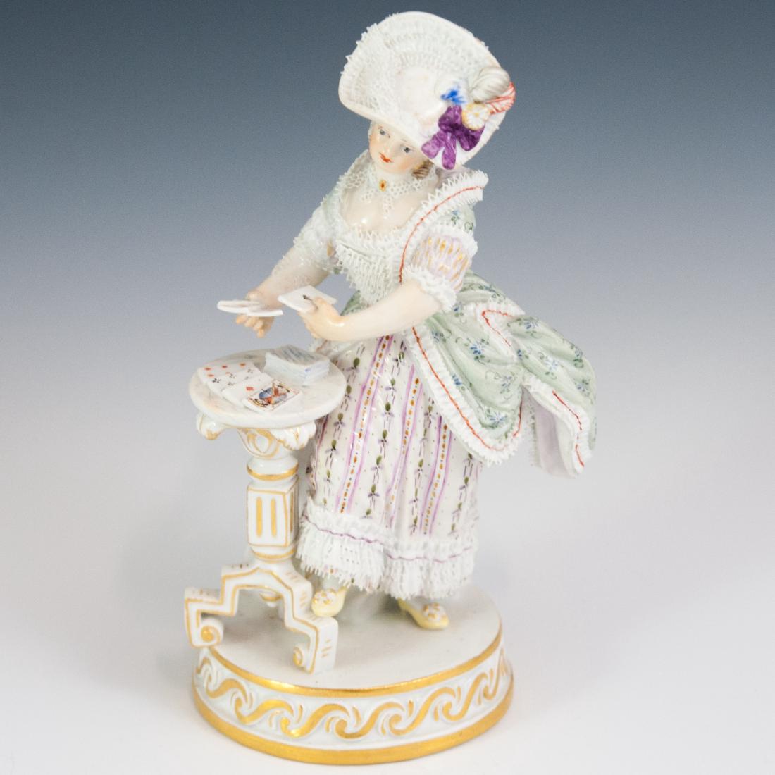 Antique Meissen Porcelain Lace Figurine: DESCRIPTION: An antique Meissen porcelain figurine of a Georgian era woman in elegant lace clothing dealing cards atop a foyer table. Finished with gilded scrolled accents along the base. Marked along