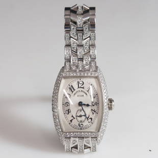 Franck Muller Chronometro 18kt Gold Diamond Watch: DESCRIPTION: A Franck Muller Chronometro 1750 S6 PM D, 18kt watch. Features an 18kt white gold band with links embellished with diamonds. Further garnished with a curved face embellished with diamonds