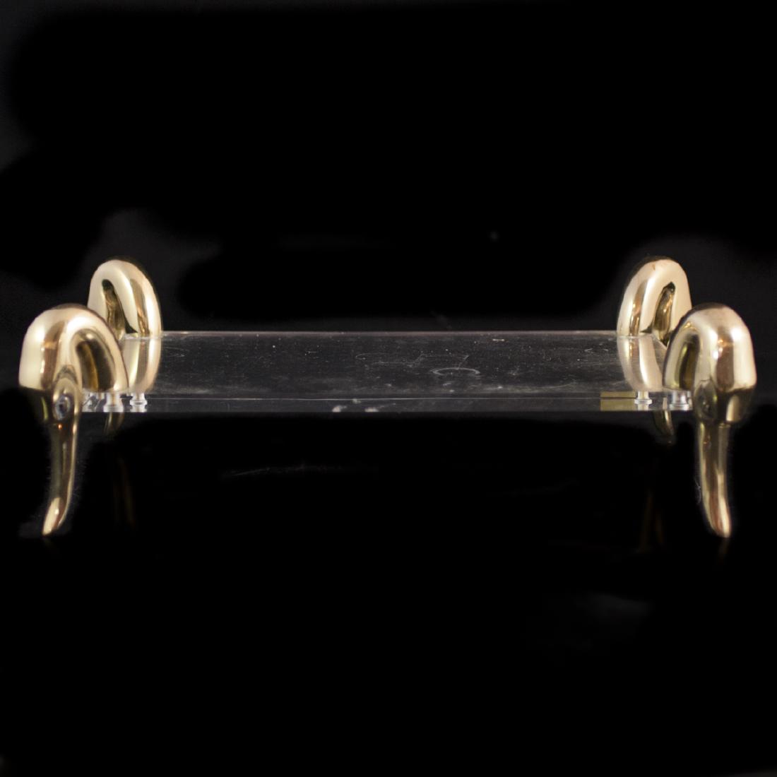 Vintage Lancelle Lucite & Brass Tray: DESCRIPTION: A vintage Lancelle, Dallas tray. Features a lucite slab garnished by brass swan head motif legs. Stickered:"Lancelle Dallas". CIRCA: Late 20th Ct. ORIGIN: Dallas, USA DIMENSIONS: H:5.75" 