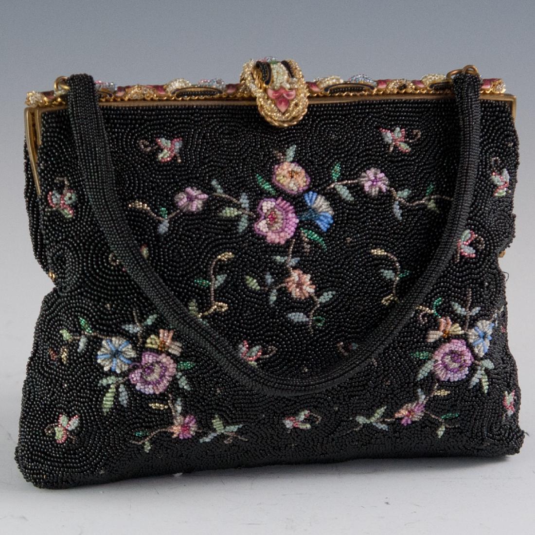 Antique Michel Swiss Enameled Beaded Purse: DESCRIPTION: An antique Michel Swiss purse. Features a beaded exterior embellished with an array of multihued floral motifs. The gilded clasp is garnished with enameled floral motifs finished with bea