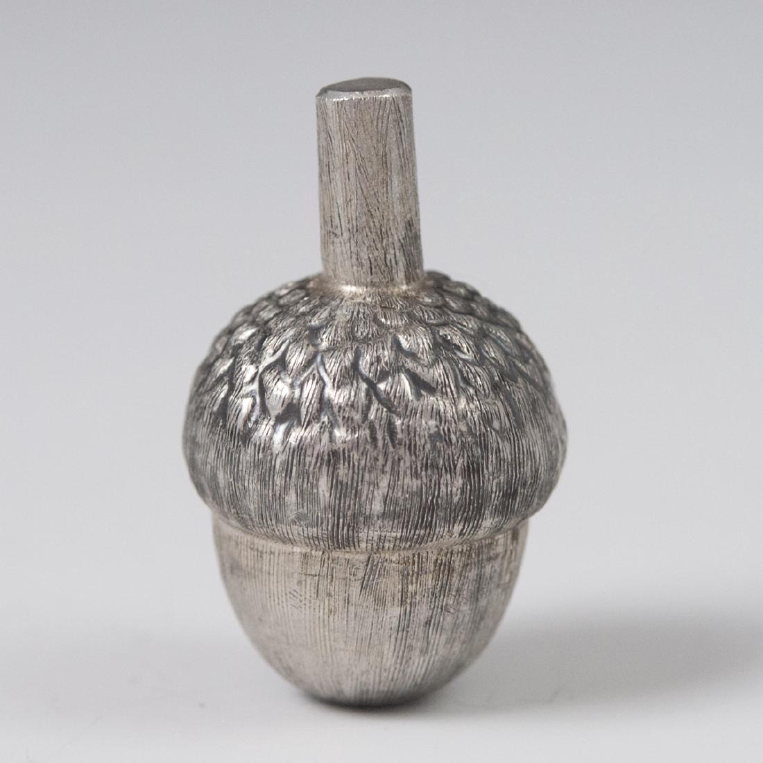 Mexican Sterling Acorn Pill Box: DESCRIPTION: A Mexican sterling acorn motif pill box. Features satin textured detailing and marked:"Mexico 925". CIRCA: Mid-Late 20th Ct. ORIGIN: Mexico DIMENSIONS: H:1 7/8" L:1 1/8" Total Weight:32 g