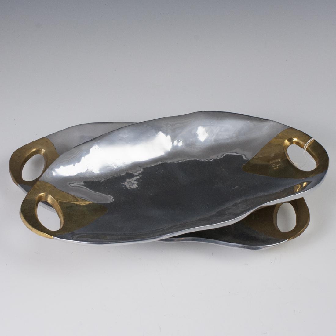 David Marshall "Washington III" Centerpieces: DESCRIPTION: A pair of David Marshall, mixed metal, "Washington III" Centerpieces. Composed of aluminum foundations, with brass handles. Stamped with David Marshall Maker's mark. CIRCA: Late 20th-Earl