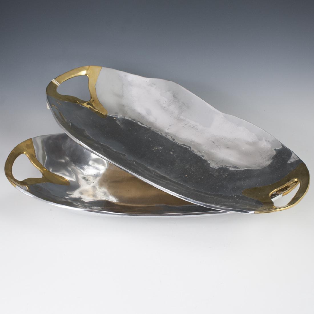 David Marshall "Washington II" Centerpieces: DESCRIPTION: A pair of David Marshall, mixed metal, "Washington II" Centerpieces. Composed of aluminum foundations, with brass handles. Stamped with David Marshall Maker's mark. CIRCA: Late 20th-Early