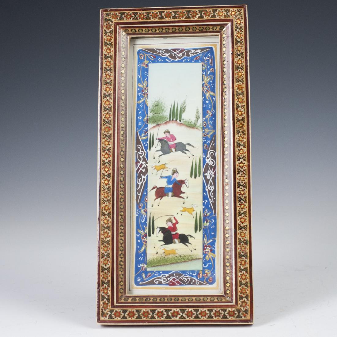 Persian Miniature Painting on Bone: DESCRIPTION: A Persian miniature painting on bone. Depicts three regal figures wielding swords, hunting gazelles, backed by an arid landscape scene. Enveloped by Oriental floral motifs on paper and se