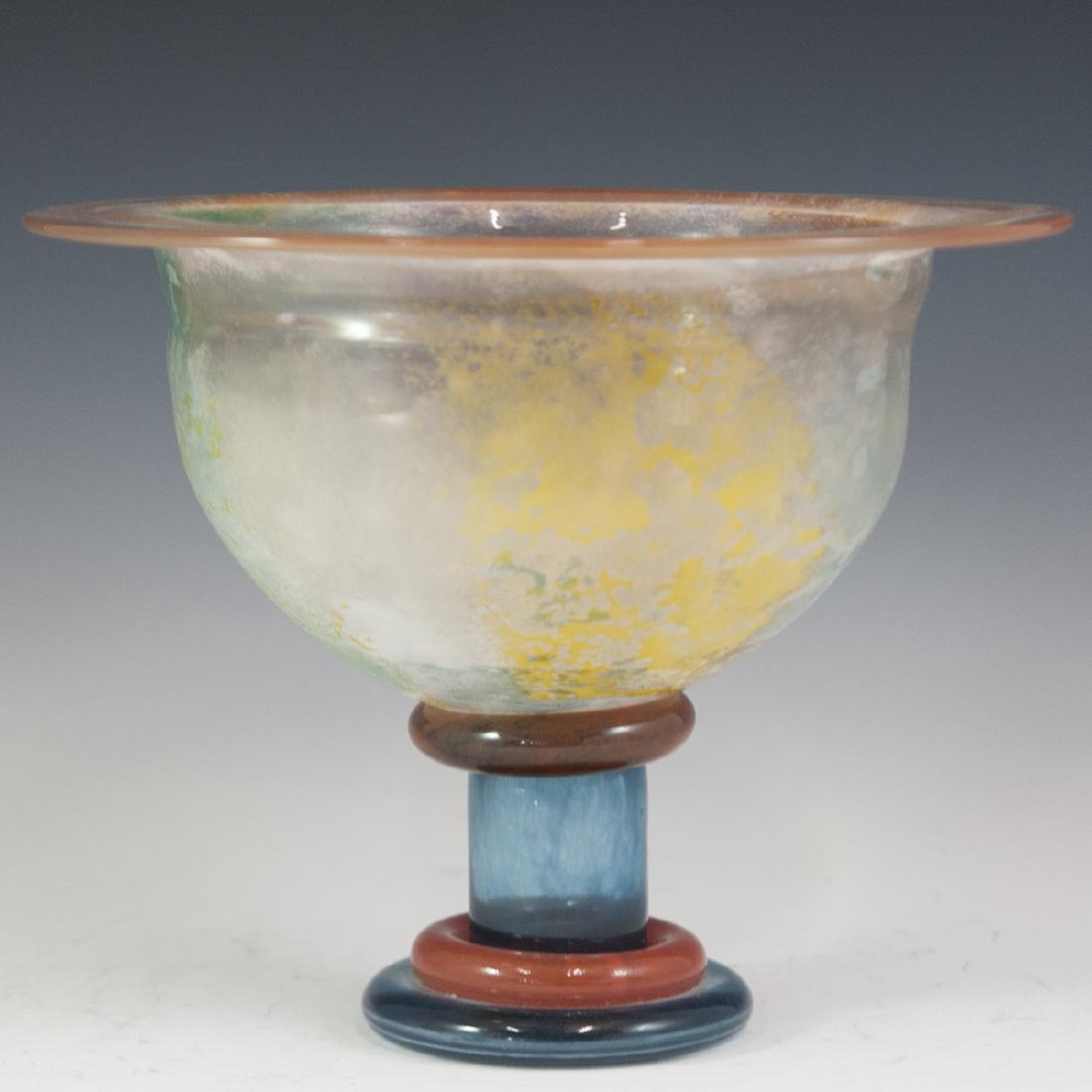 Kosta Boda Kjell Engman Glass Bowl: DESCRIPTION: A large Kosta Boda by Kjell Engman footed centerpiece bowl. Features a frosted glass bowl with frosted hues and a flattened rim. Rests atop a multihued stem and base. Marked:"K Engman" al