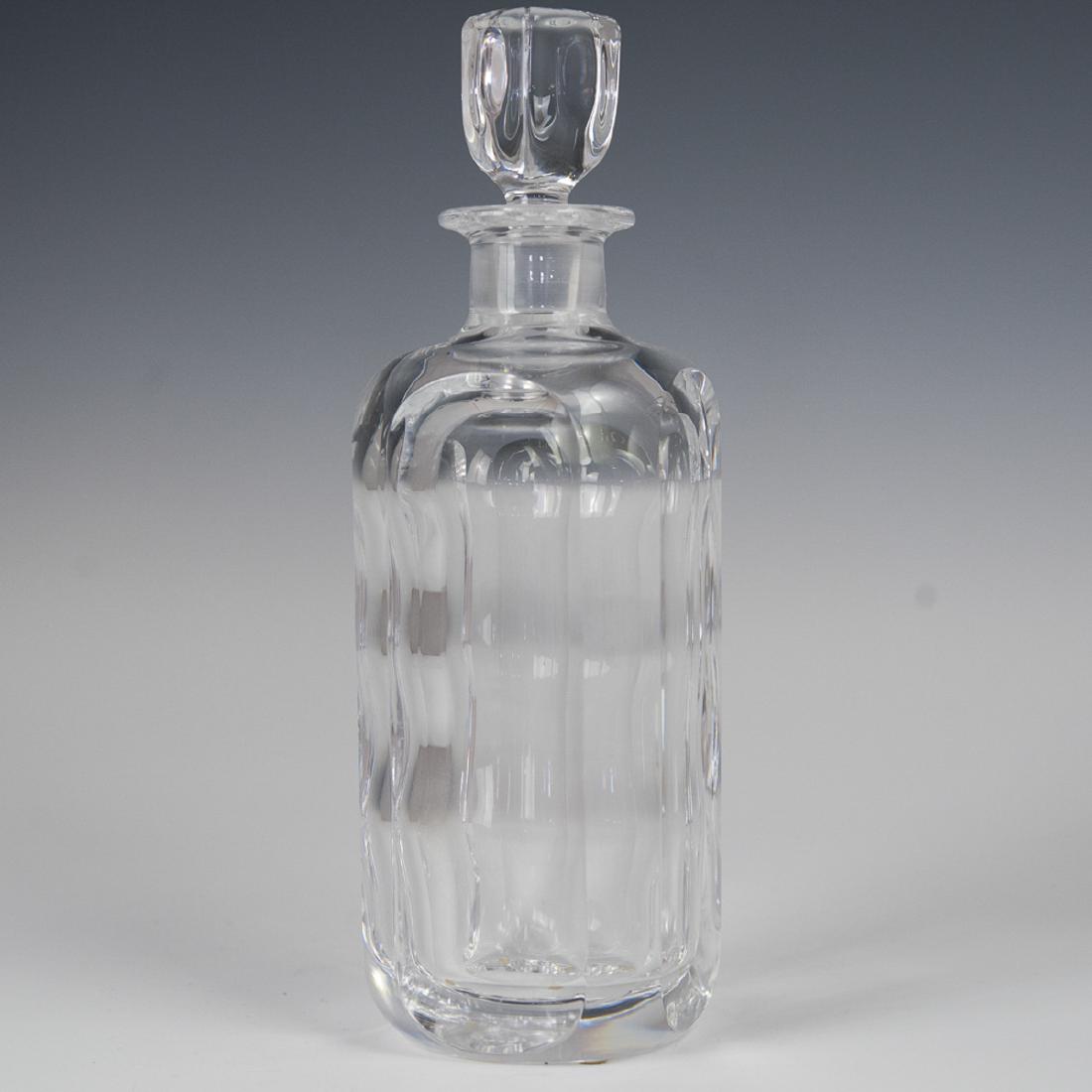Orrefors Sven Palmqvist Crystal Decanter: DESCRIPTION: An Orrefors, Sven Palmqvist designed, heavy crystal decanter. Features pill form concaved along the cylindrical body and a cubical stopper with raised ovals. Marked:"Orrefors" along the u