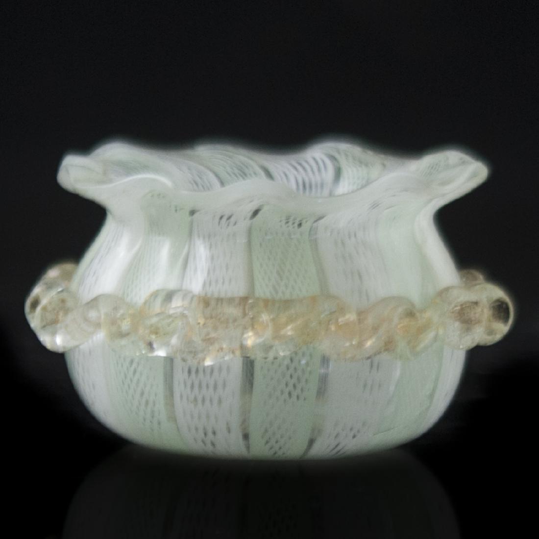 Murano Glass Zanfirico Cellar: DESCRIPTION: A vintage Murano glass open cellar. Features a bulbous form with waved edges along the rim, and swirled detailing enveloping the center body. Finished with interior Zanfirico swirls in a 
