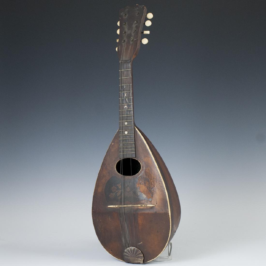 Antique Wooden Mandolin: DESCRIPTION: An antique wooden mandolin. Garnished with mother of pearl discs along the neck and finished with carved bone hardware. CIRCA: Late 19th-Early 20th Ct. ORIGIN: Continental DIMENSIONS: L:2