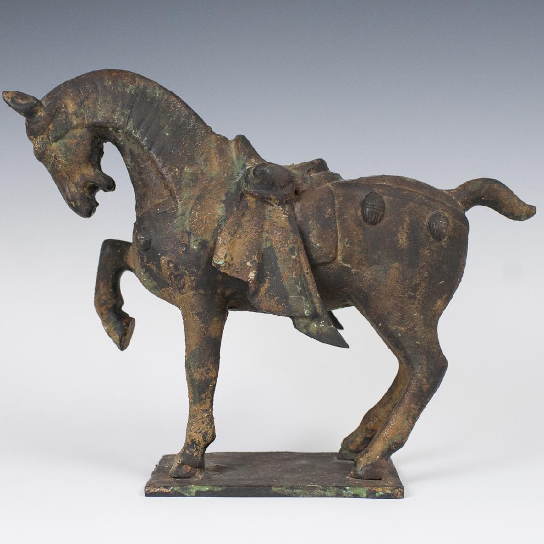 Japanese Cast Iron Horse Sculpture: DESCRIPTION: A vintage Japanese cast iron sculpture of a horse, elegantly saddled and standing with its right hoof raised. CIRCA: Early 20th Ct. Marked "JAPAN" and signed on the bottom. ORIGIN: Japan 