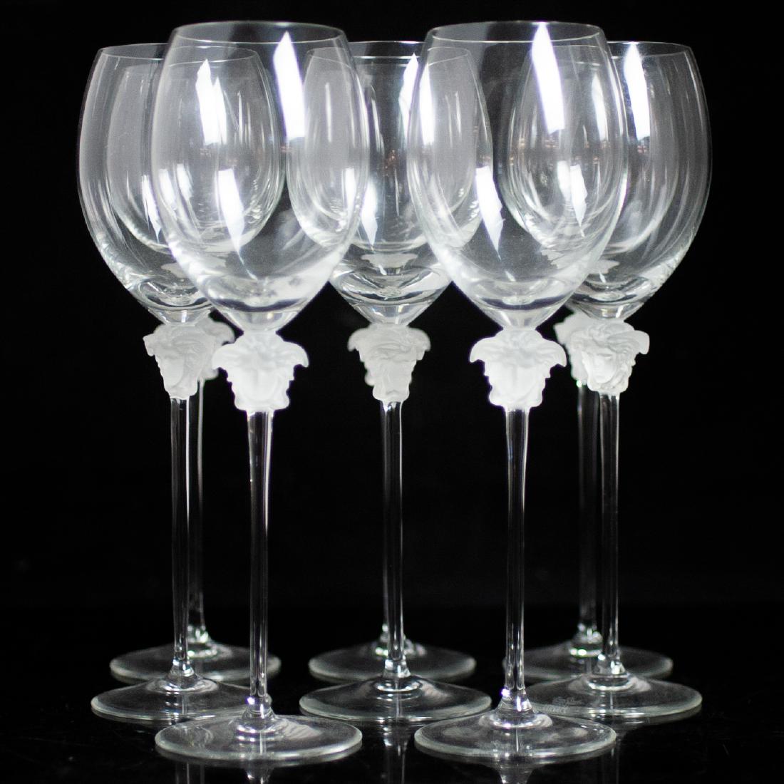 (8) Rosenthal Versace Crystal "Medusa Lumiere" White: DESCRIPTION: A set of 8 Rosenthal Versace crystal, "Medusa Lumiere" patterned white wine glasses. Composed of clear crystal foundations, embellished with frosted crystal Medusa heads along the tops of