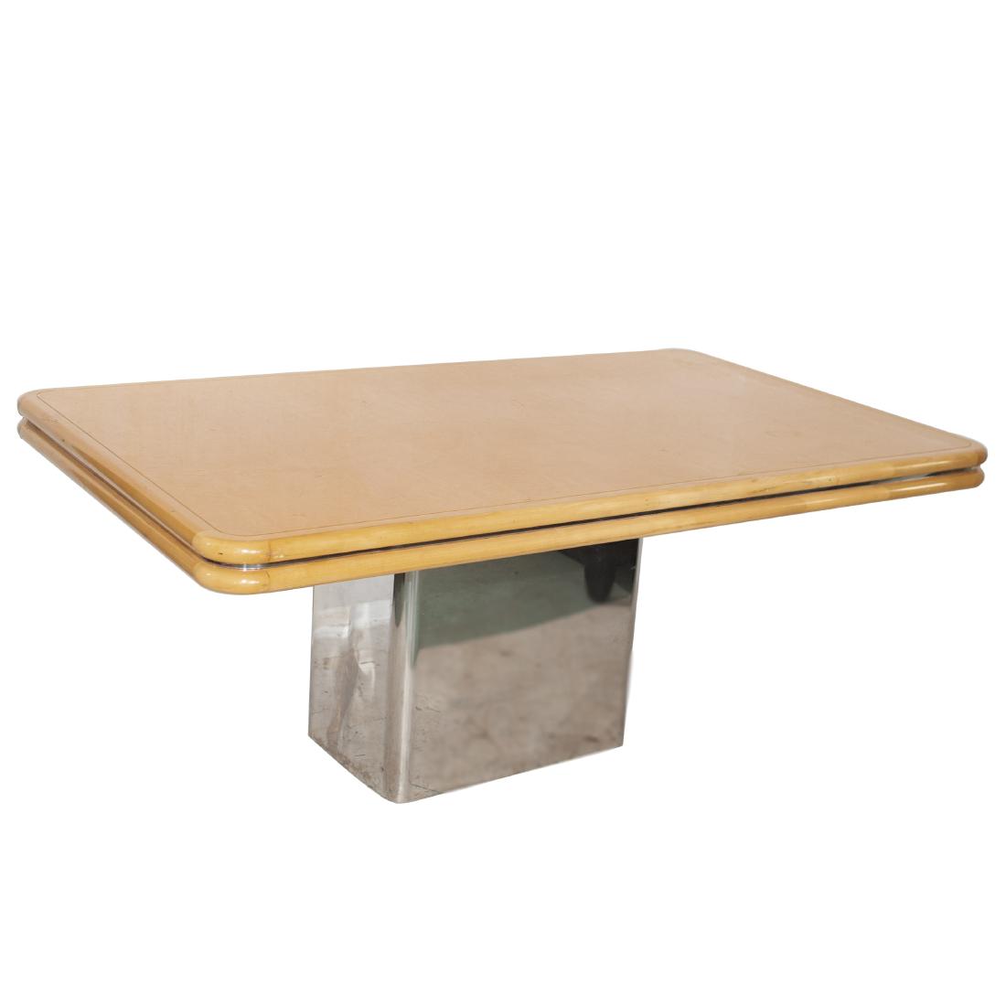 Brueton Dining Table: DESCRIPTION: A Brueton dining table composed of a cubical, stainless steel base supporting the birds eye maple table top lined with stainless steel embellishment. CIRCA: Late 20th-21st Ct. ORIGIN: USA