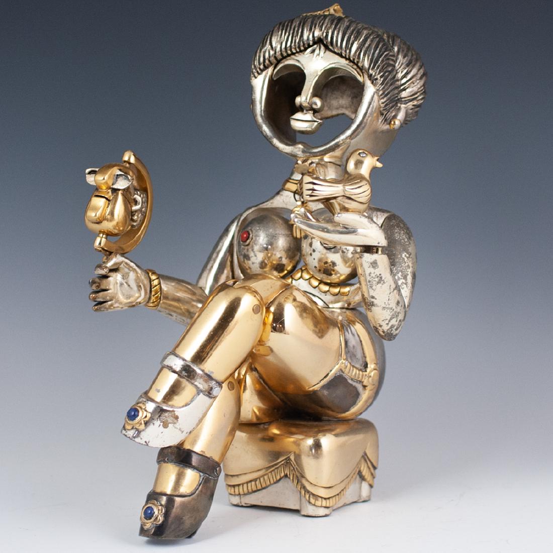 Frank Meisler Articulated Sculpture: DESCRIPTION: A limited edition Frank Meisler sculpture of a seated queen wielding a dove and a rotating head of an elder man on an axis. Articulated along the knees, rotates at the waist, bosom, and h