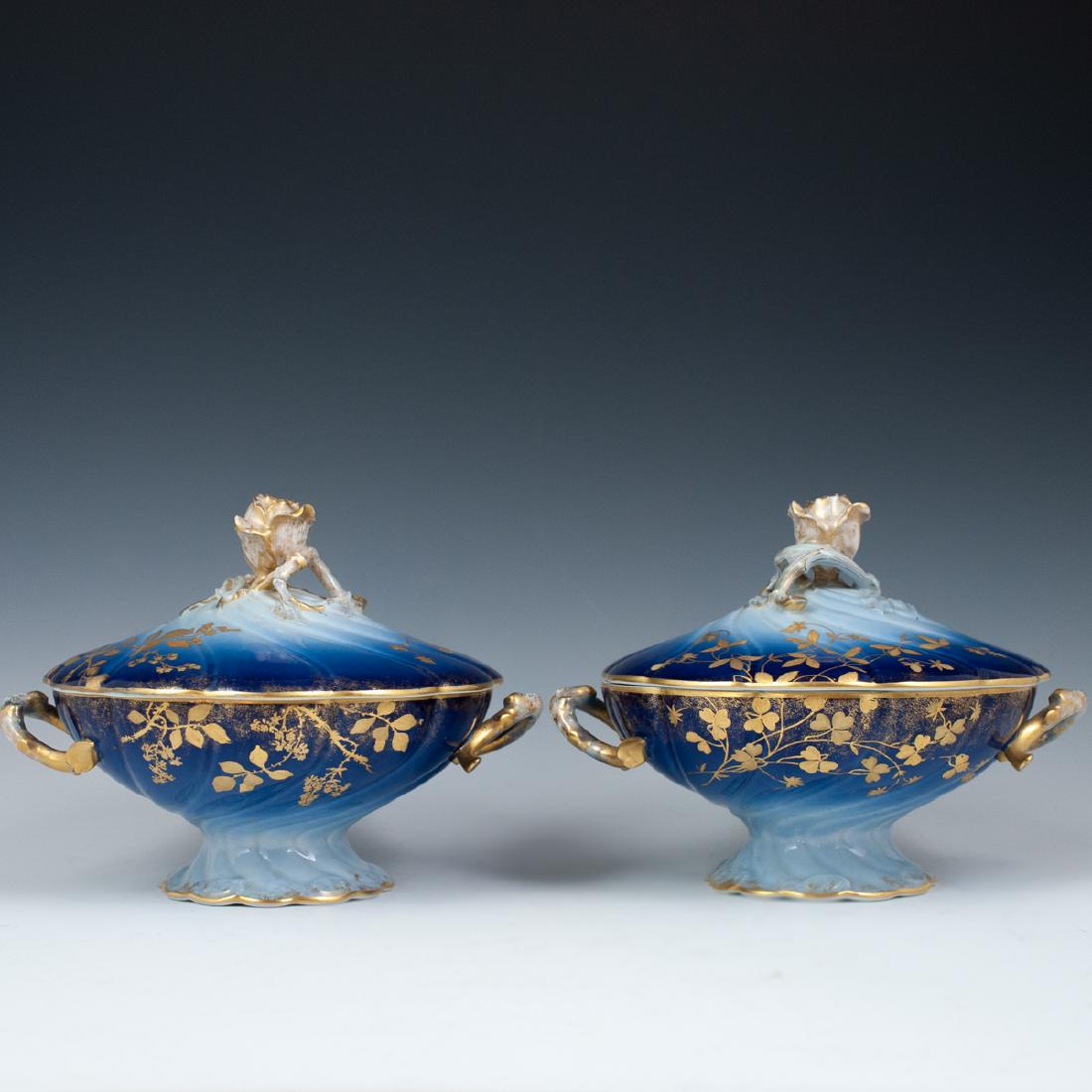 Antique Jean Pouyat Limoges Turrines: DESCRIPTION: A pair of antique Jean Pouyat Limoges lidded turrines. Composed of an overall rotund, swirled design with rich shade of blus glazes throughout, further decorated with gilt enameled floral