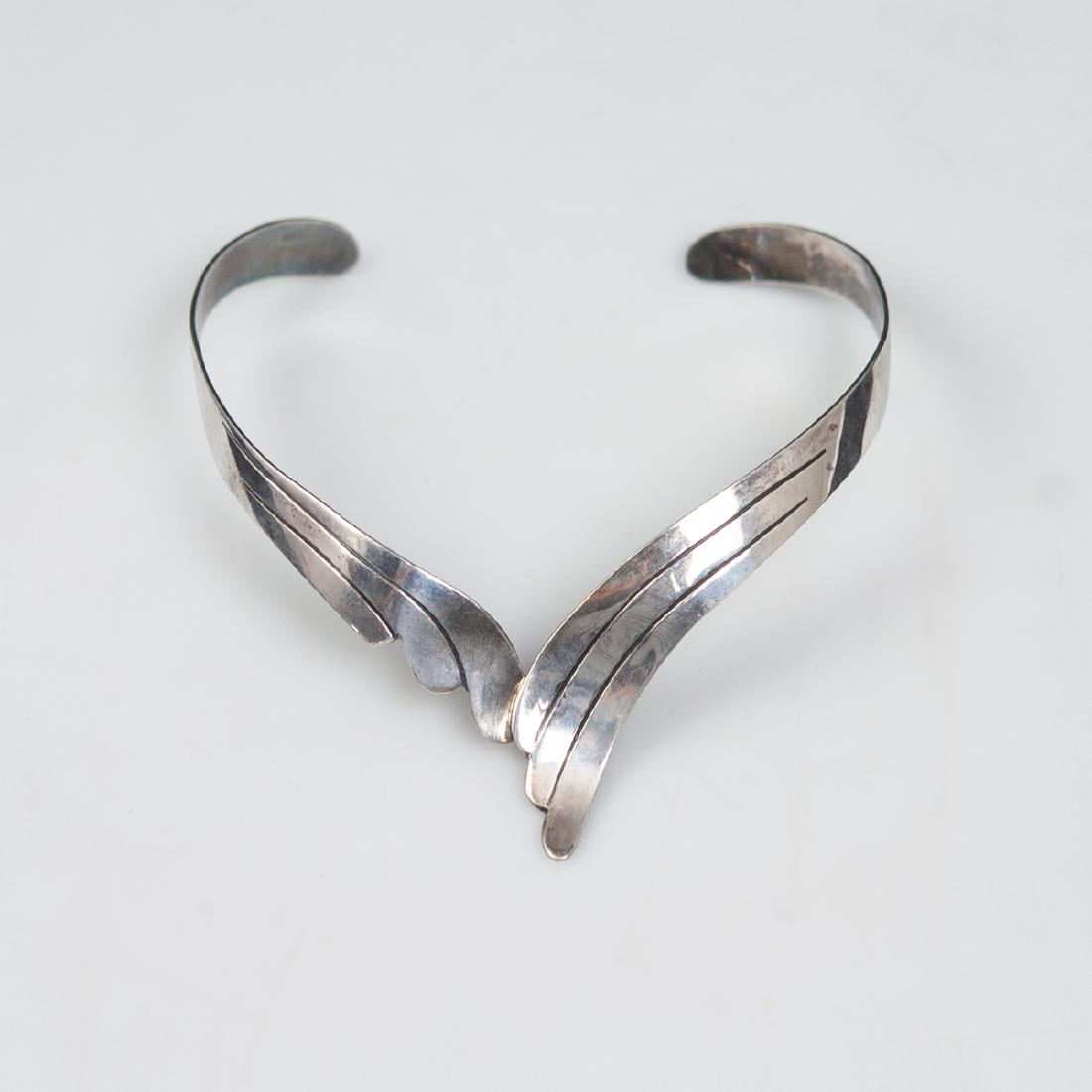 Possibly Mexican Sterling Choker Necklace: DESCRIPTION: A possibly Mexican sterling choker necklace. Embellished with waved, ridged designs. Not marked but tested for sterling silver. CIRCA: Mid-Late 20th Ct. ORIGIN: Mexico DIMENSIONS: Interio