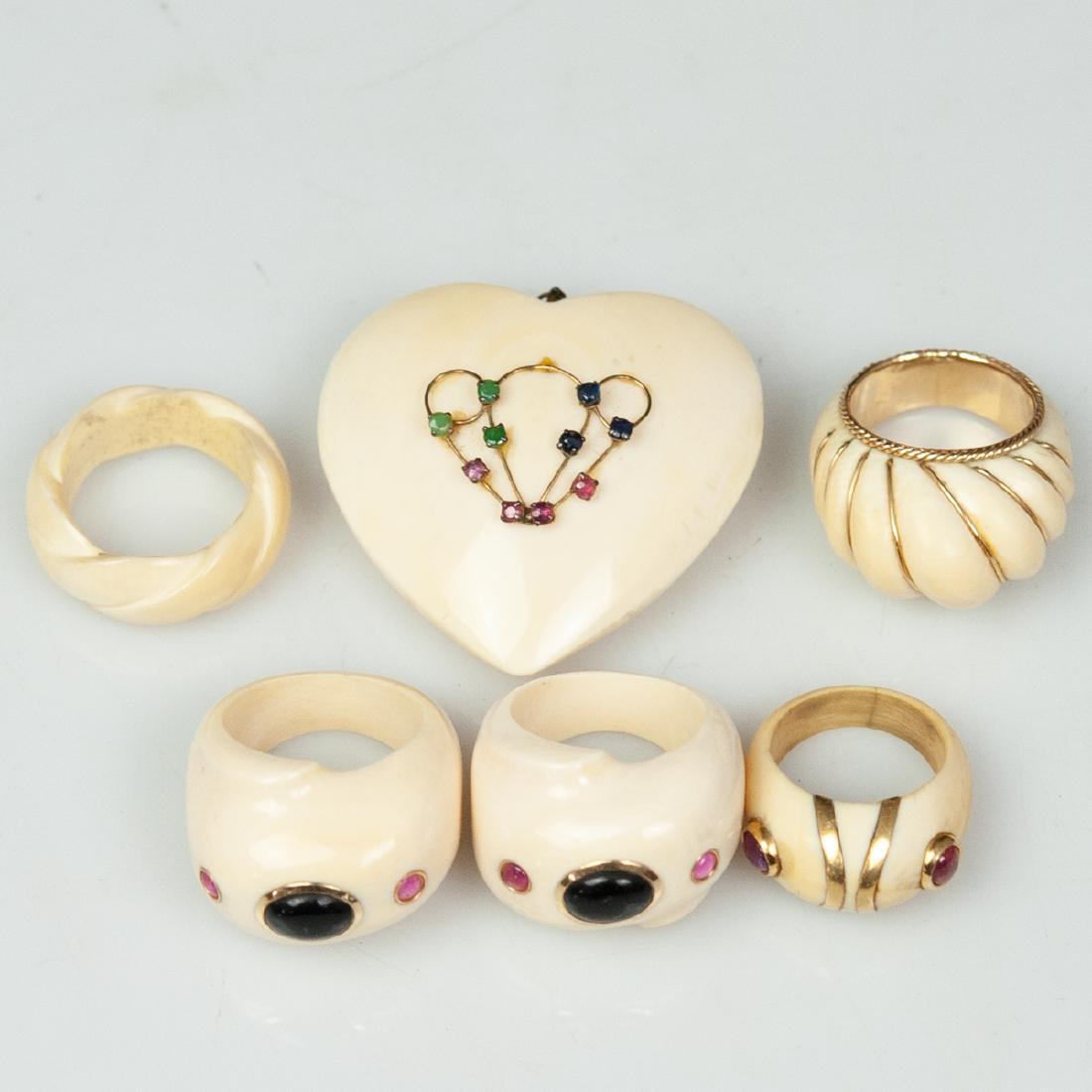Carved Bone & 14kt Gold Jewelry: DESCRIPTION: A lot of carved bone jewelry composed of the following: - 1 heart shaped pendant garnished with emeralds, sapphires, and rubies. Marked:"14kt". H:1.5" L: 1 5/8" - 1 ring garnished with a