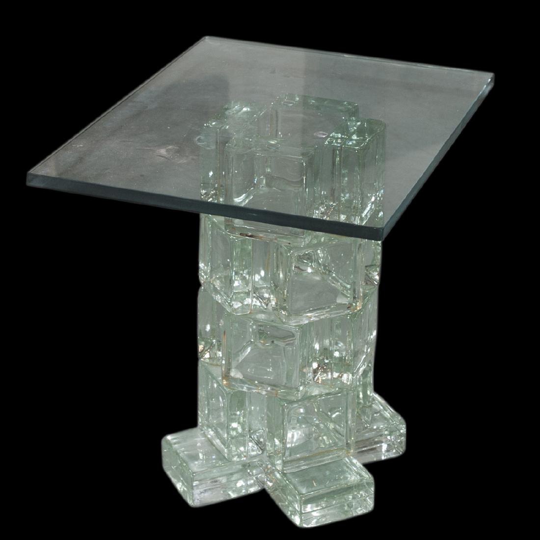 Mid Century Glass Table: DESCRIPTION: Mid century table features a a mult level block base crafted from solid glass. The base has five levels finished by a mounted glass table top. CIRCA: 20th Ct. ORIGIN: USA DIMENSIONS: Base