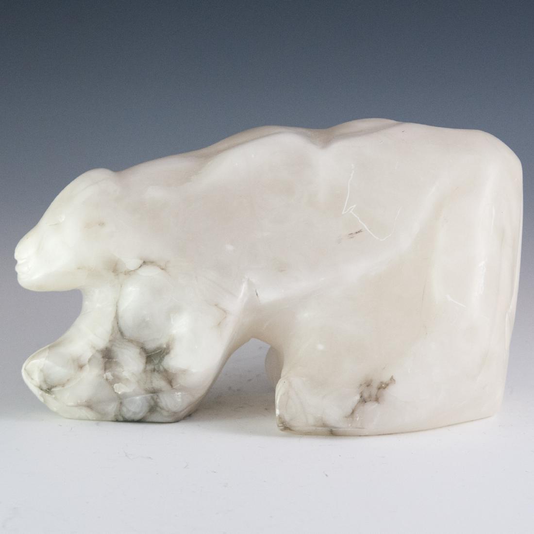 White Alabaster Sculpture: DESCRIPTION: A white alabaster sculpture of a polar bear. Unsigned. CIRCA: 20th Ct. DIMENSIONS: H:6.5" L:11" W:5.5" CONDITION: Fair condition, minor chips and scratches. See lot description for detail
