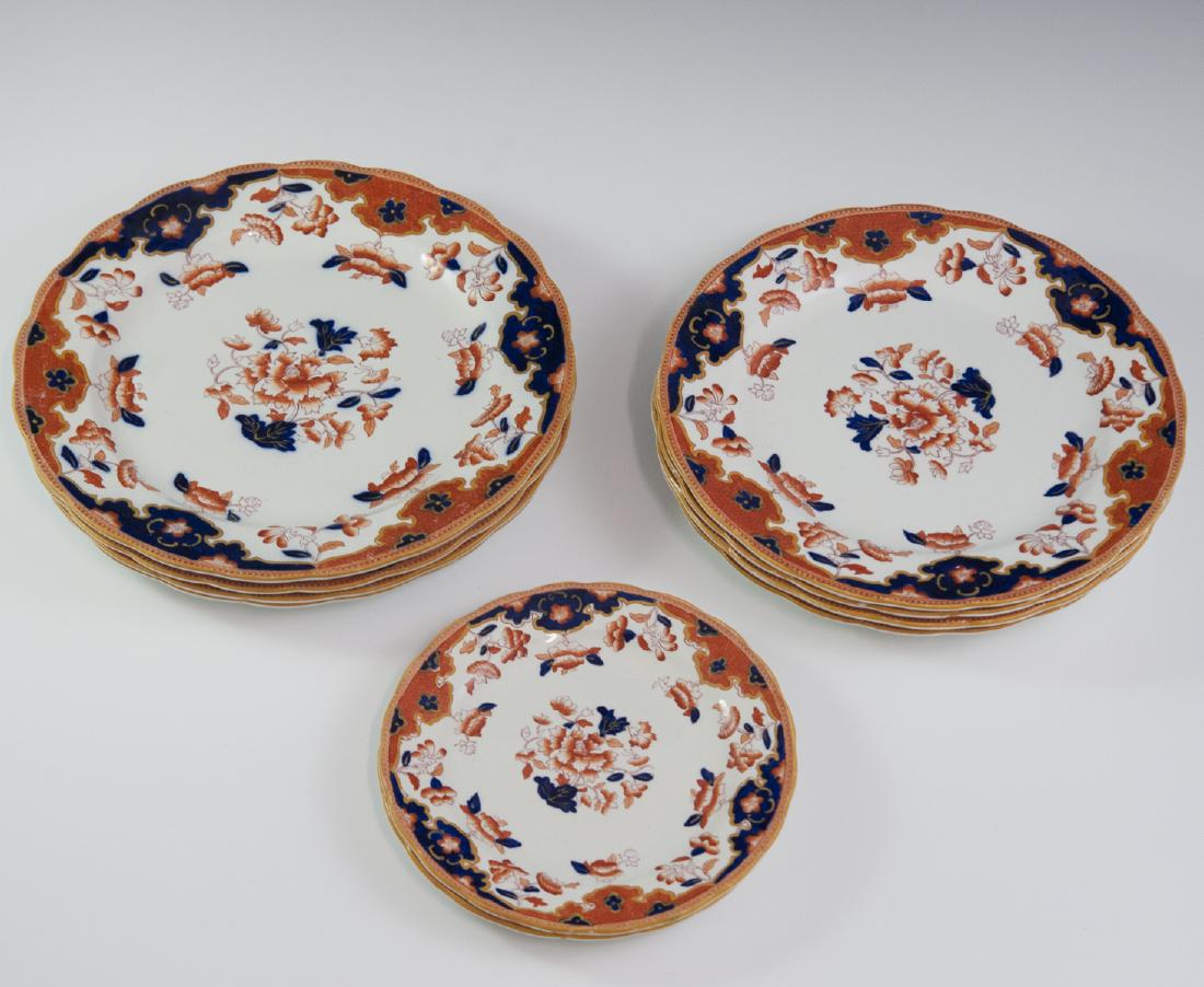 Porcelain Imari Ware Plates: DESCRIPTION: A set of 4 dinner, 4 salad, and 2 smaller, porcelain plates with an overall rust hued and cobalt blue Imari style motif with floral accents and a crackle glaze. Marked with impressed:"PG"