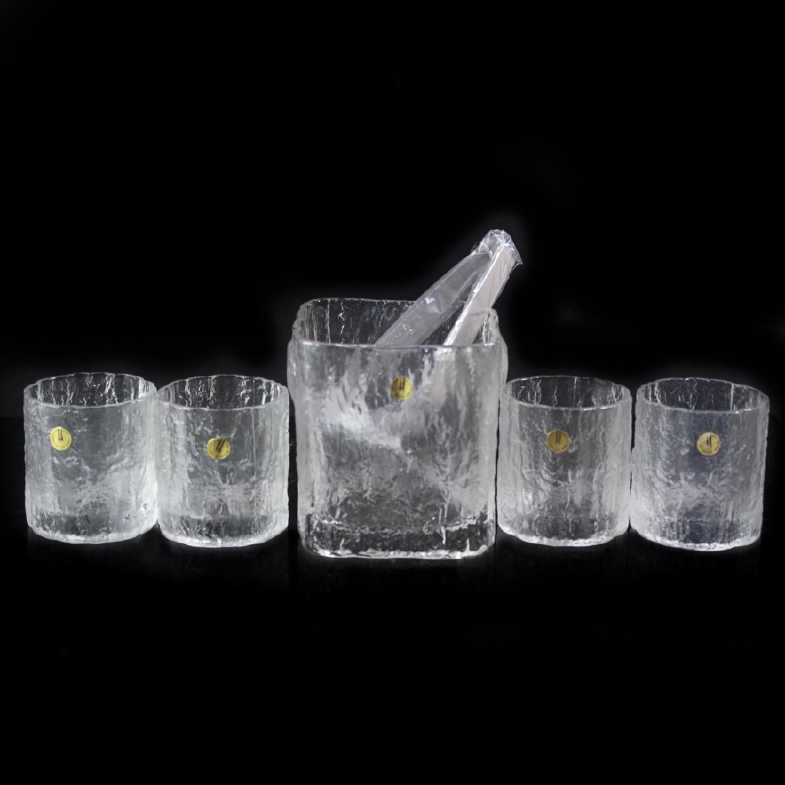 Hoya Textured Crystal Set: DESCRIPTION:Crystal set by Hoya. Comprises of four whiskey glasses and an ice bucket with stainless steel tongues. Features textured exterior made to look like ice cubes. Stickered: "Hoya Corporation