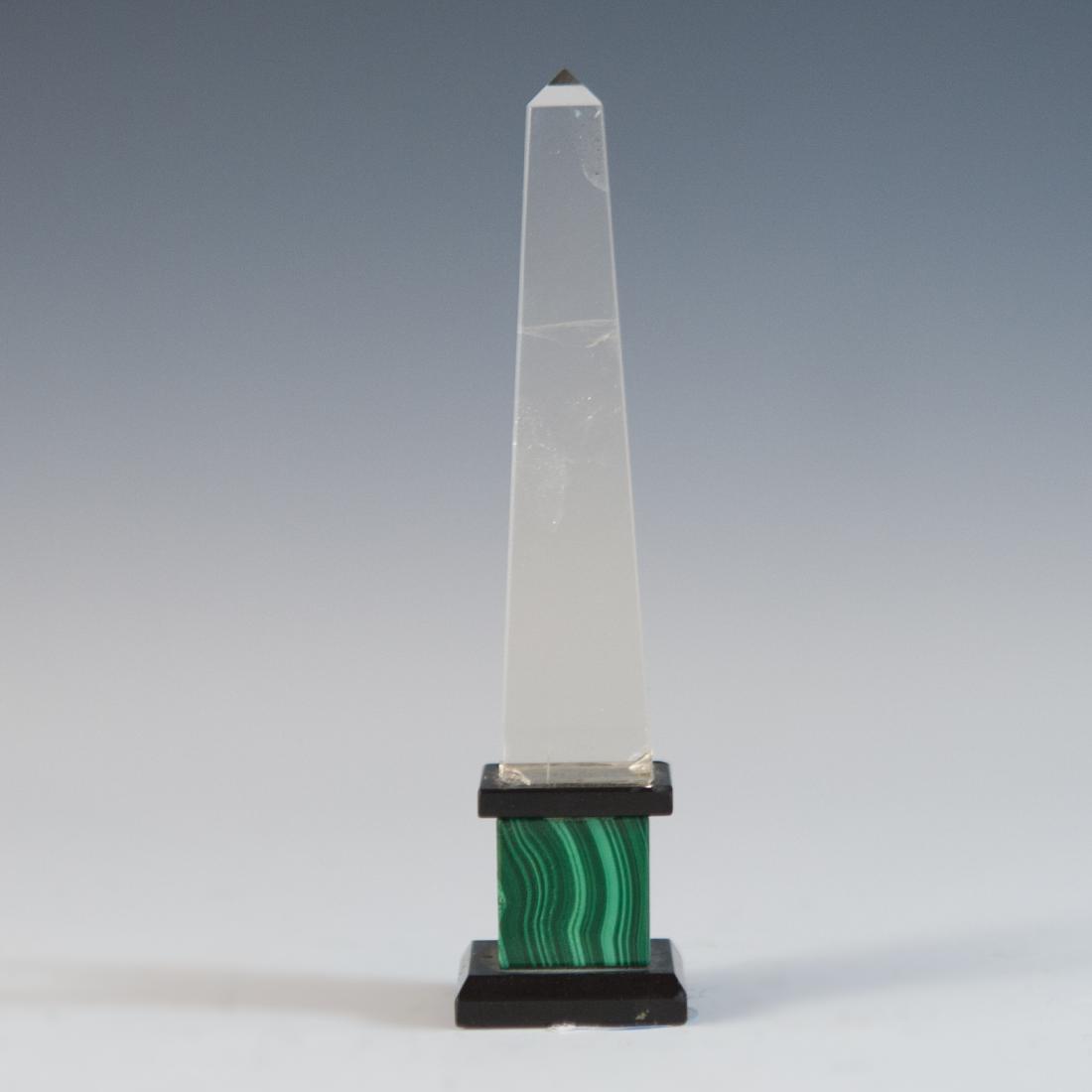 Crystal & Malachite Obelisk: DESCRIPTION: This obelisk features a rock crystal pillar atop a slate and malachite base. CIRCA: Early 20th Ct. DIMENSIONS: H: 4.5" L: 1" CONDITION: Some wear to the crystal. See lot description for d