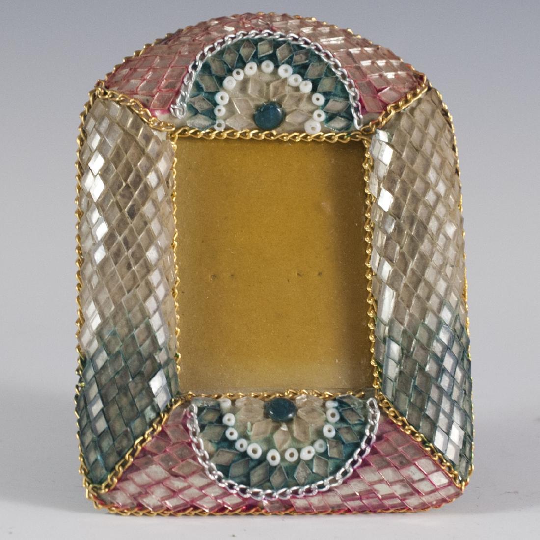 Scaled Glass Picture Frame: DESCRIPTION:Picture frame embellished with glass marquetry in a scaled fashion. Each tile is bordered in red and turquoise colors and finished with metal chain accents. CIRCA:20th Ct. DIMENSIONS:H:4.2