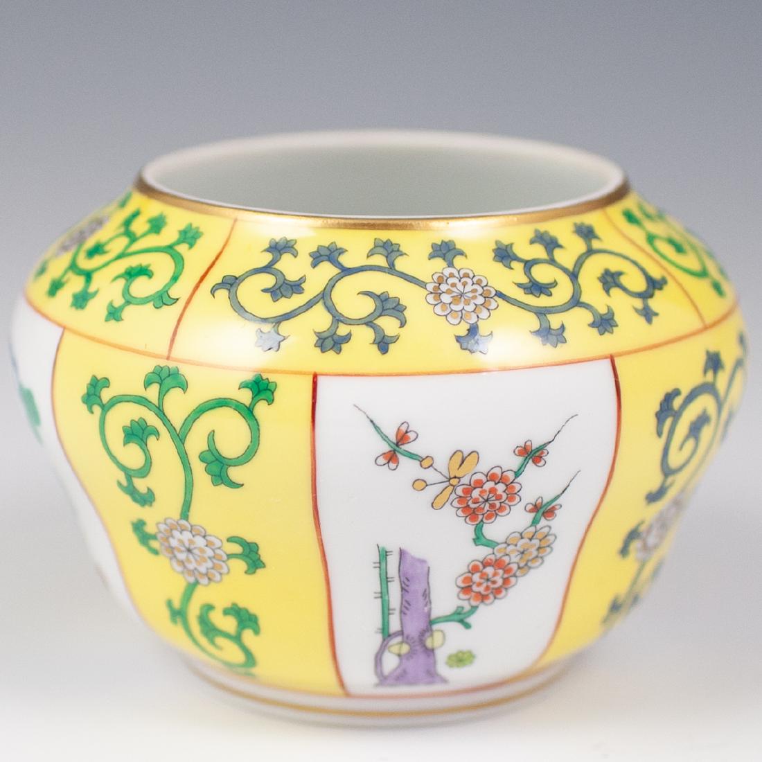 Yellow Dynasty Herend Bowl: DESCRIPTION: Yellow Dynasty pattern hand painted porcelain bowl by Herend. Features blue, purple, green, yellow floral and tree motifs. Marked on underside "Hand Painted Herend Hungary 6095/97" with c