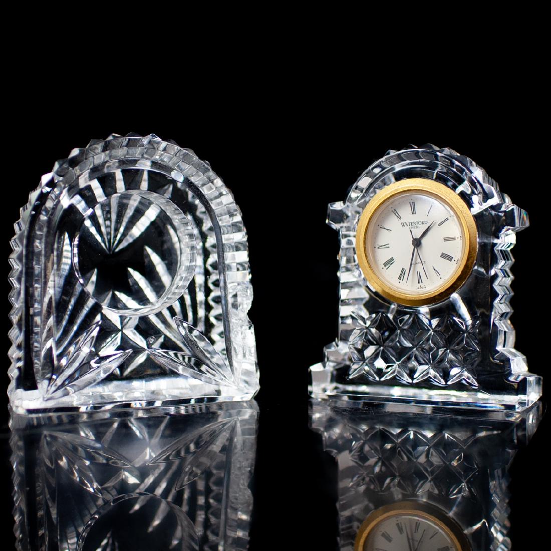 Waterford Crystal Clock: DESCRIPTION: A Waterford Crystal clock featuring a ridged, crystal cut casing and a Japanese movement clock. Marked:"Waterford Crystal Japan" and Waterford acid etched on the bottom. An extra clock ba