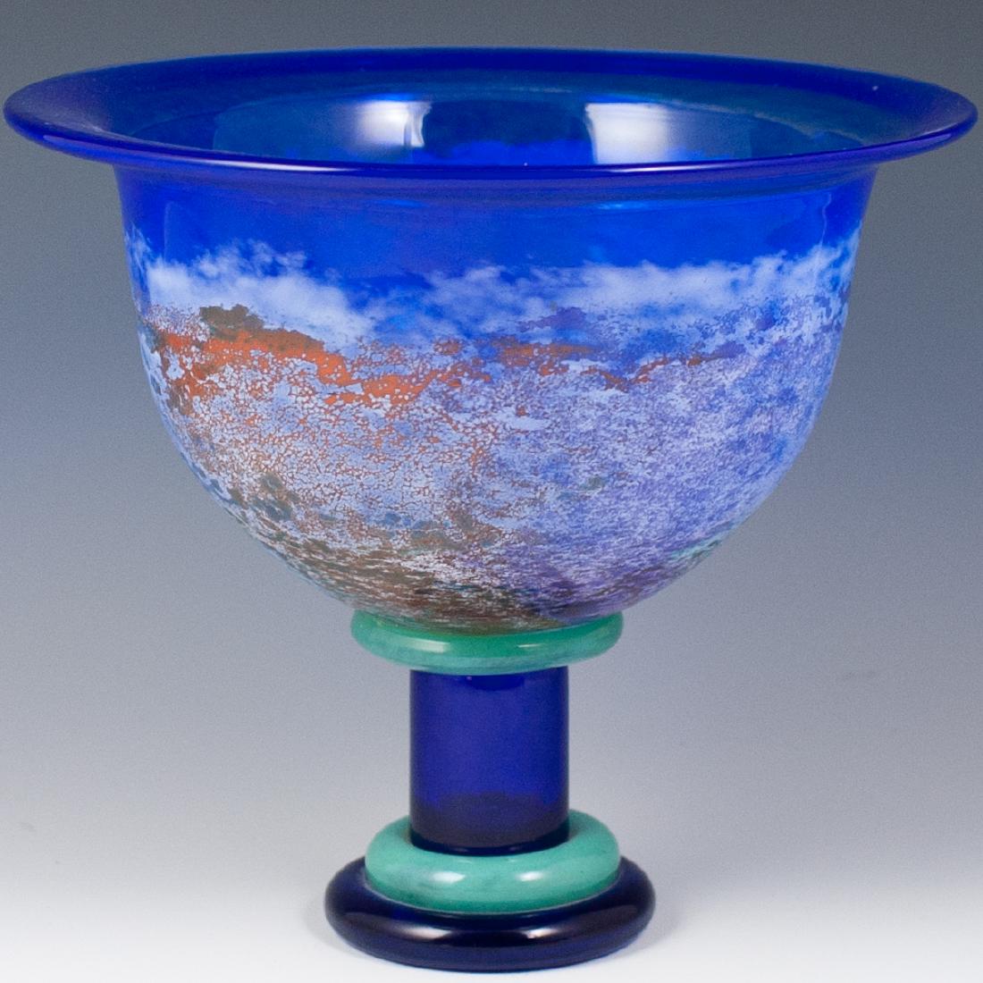 Kosta Boda Kjell Engman Crystal Bowl: DESCRIPTION: A large Kosta Boda by Kjell Engman footed centerpiece bowl. Features a frosted crystal bowl with frosted hues and a flattened rim. Rests atop a multihued stem and base. Marked with signat