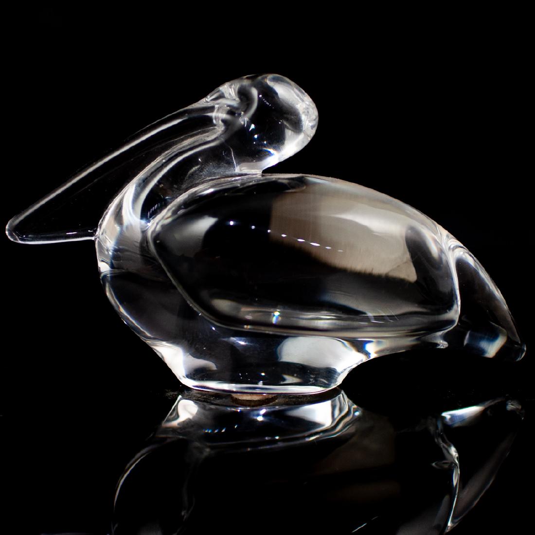 Baccarat Crystal Pelican: DESCRIPTION: A a clear crystal resting pelican in a minimalist rendition. Marked underneath "Baccarat France" CIRCA: 20th Ct. ORIGIN: France DIMENSIONS: L: 5" H: 2 3/4" CONDITION: Great condition. See