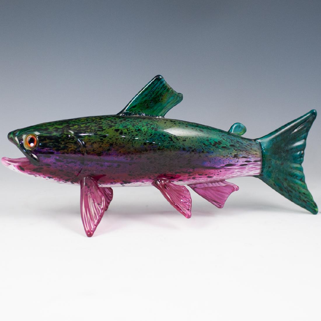 Michael Hopko Art Glass Fish: DESCRIPTION: A hand blown art glass fish by American artist Michael Hopko in a mix of green, purple and pink hues with dark spotted skin. Signed on the underside "Michael Hopko 2001" CIRCA: 21st Ct. O