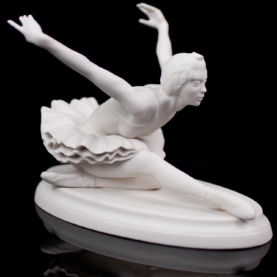 Boehm Limited Edition "Swan Lake" Porcelain: DESCRIPTION: A Boehm bisque porcelain titled "Swan Lake" features a young ballerina in mid pose, includes original box. Marked on the underside "The Edward Marshall Boehm Studios Present Classic Momen