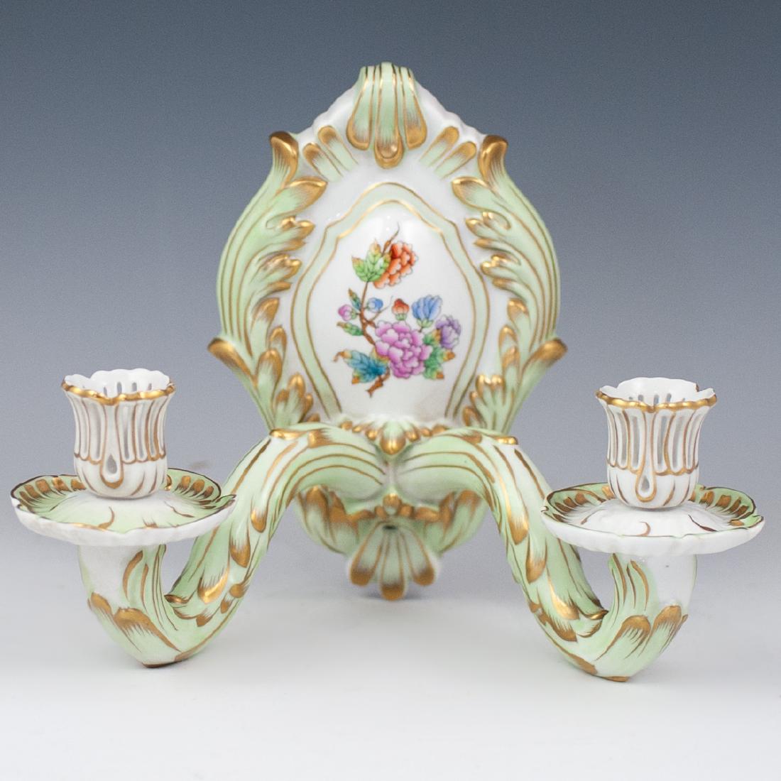 Herend Porcelain "Queen Victoria" Sconce: DESCRIPTION: A Herend porcelain "Queen Victoria" patterned Sconce. Features a two arm sconce with overall motifs of chrysanthemum flowers and butterflies. Finished with gilded trims and accents. Marke