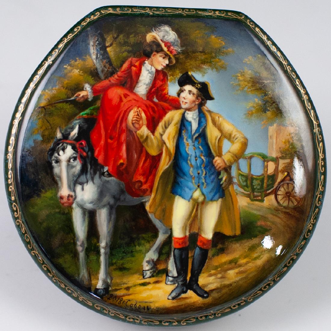 Russian Lacquered Erotic Box: DESCRIPTION: Russian lacquered papier mache boxes. The box features a dark green base hue in an overall circular shape, decorated with multiple hand painted Edwardian erotic scenes on the lid. Opens r