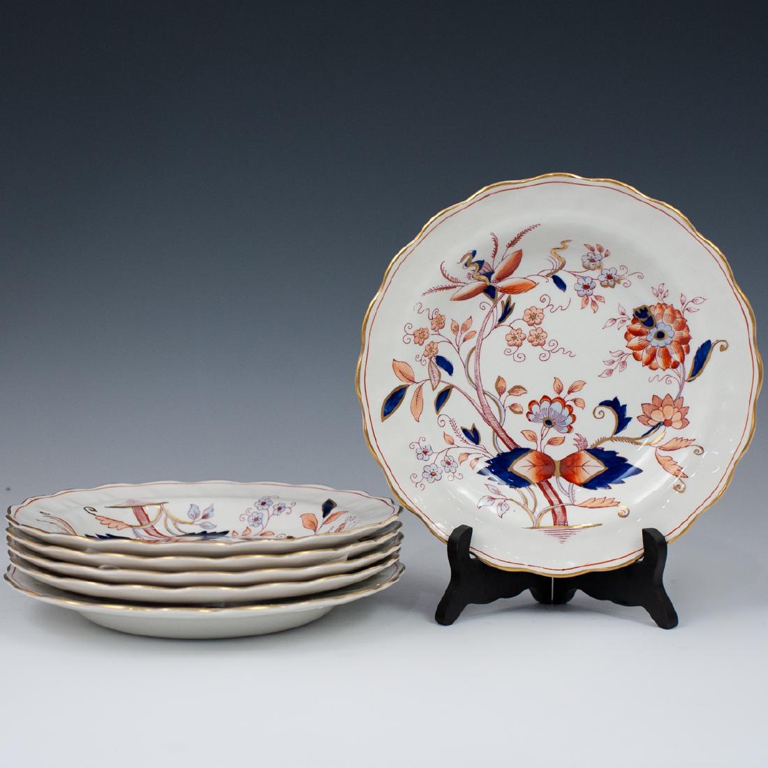 (6 Pc) Set Of Booths "Fresiah" Porcelain Bowls: DESCRIPTION: A set of six Booth porcelain bowls titled "Fresiah" features a floral patterned rim, embellished along the interior with red and blue hued floral motifs, finished with gilded trims and ac