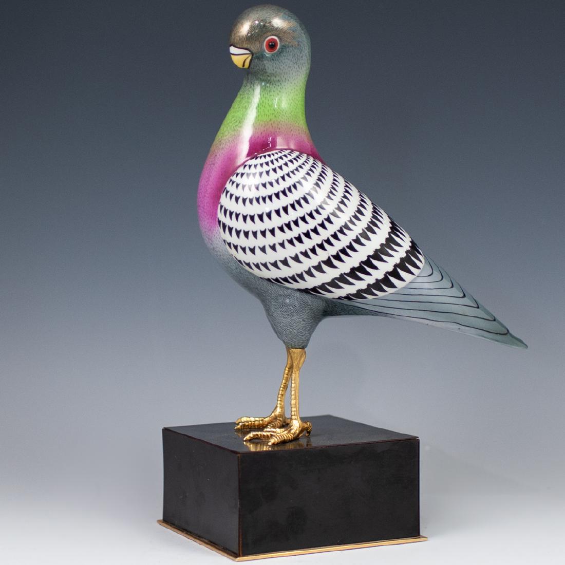 Probaby Oggetti enameled bird: DESCRIPTION: Probably Oggetti enameled bird features a porcelain foundation with multi hued enameled decoration along the feathers, finished with gilded accents along the face. Finished with 24kt gold