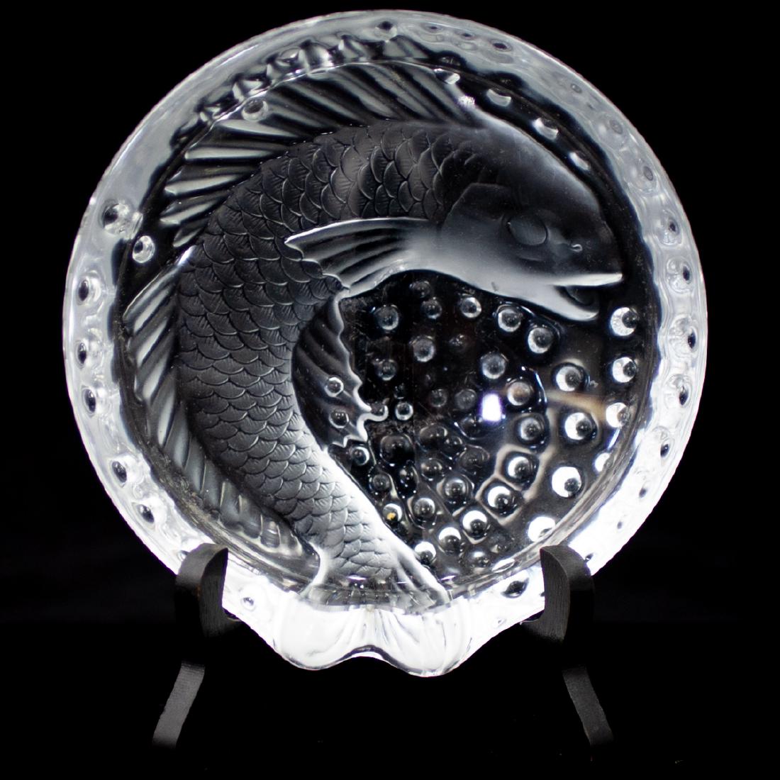 Vintage Lalique "Concarneau" ashtray: DESCRIPTION: Vintage Lalique crystal "Concarneau" ashtray featuring a coy fish and bubbles throughout. Marked Lalique France on the rim. CIRCA: 1970-1980s ORIGIN: France DIMENSIONS: H:2" high and 6.5"