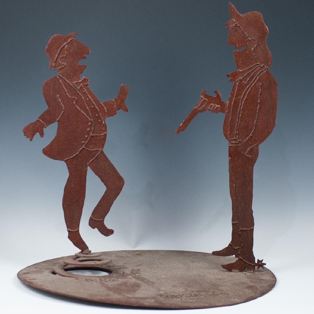 Rosemary Pozzi Franzetti Iron Sculpture: DESCRIPTION: A sculpture by American artist Rosemary "Pozzi" Franzetti composed of patinated iron in a rustic hue. The sculpture has a circular base depicting a western scene of one man shooting at th