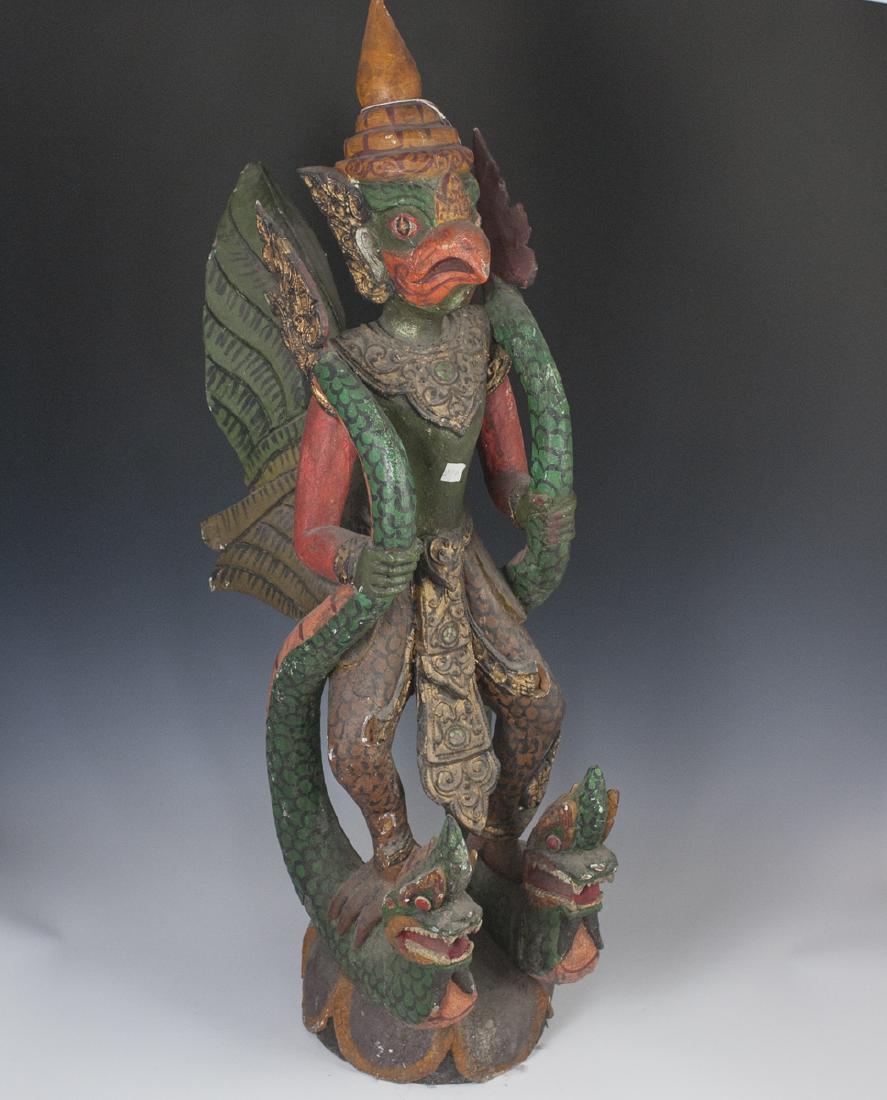 Antique Burmese Wooden Polychromed Garuda: DESCRIPTION: An antique Burmese, carved wooden sculpture of Garuda, wielding two serpents. Finished with polychromed detailing throughout. CIRCA: Late 19th-Early 20th Ct. ORIGIN: Burma DIMENSIONS: H:4