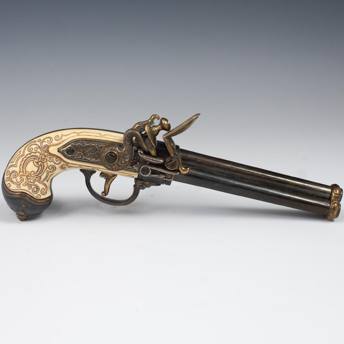 Antique Decorative Handgun: DESCRIPTION: Antique Decorative Handgun. Features a wooden foundation with a metal barrel, trigger, and hammer. Inlaid with bone in Oriental motifs. Finished with a triple barrel design. CIRCA: 20th O