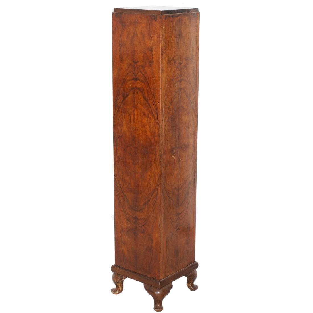 Art Deco Elm Wood Pedestal: DESCRIPTION: An Art Deco pedestal in an overall rectangular form, composed of elmwood stands on four curved feet. CIRCA: Early-Mid 20th Cent. ORIGIN: Continenta; DIMENSIONS: H: 51 5/8" L: 10 1/2" W: 1