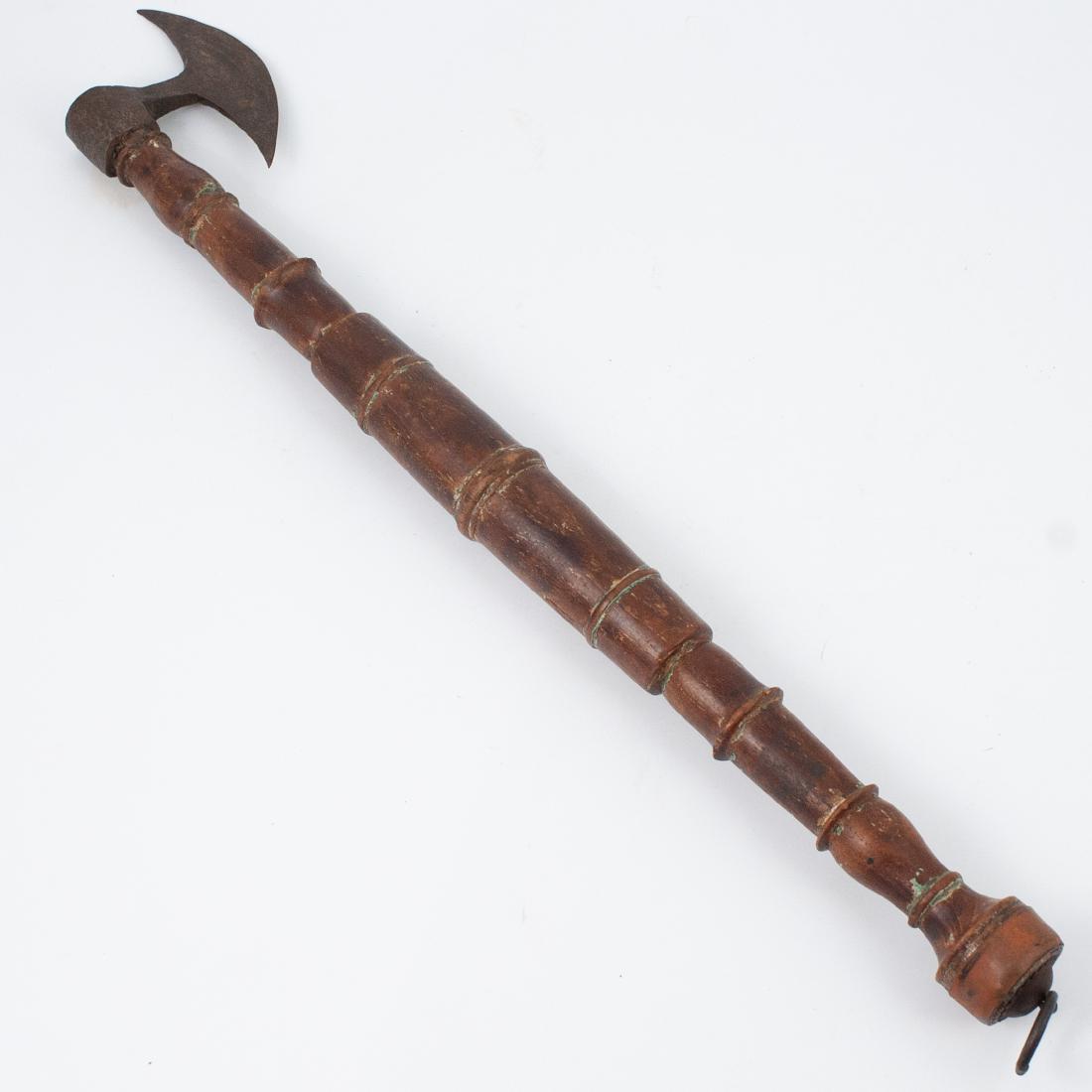 Antique Hatchet: DESCRIPTION: An antique hatchet composed of a spindled wood handle and a rough metal blade. Fitted with a ring along the bottom of the handle for hanging. DIMENSIONS: L:25.5" CONDITION: Fair age appro